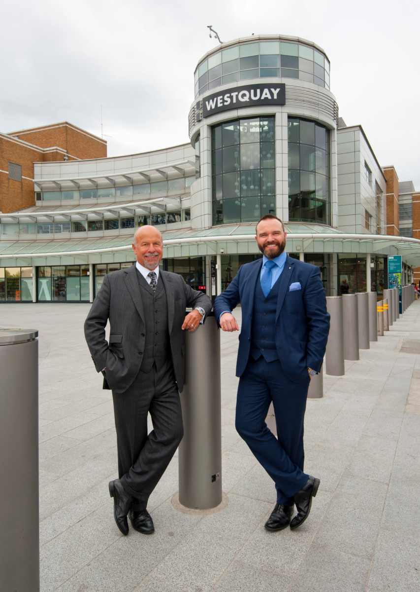 Parkhouse, the luxury family jewellers, has announced a store move from Above Bar, Southampton, to the new luxury corner in Westquay. The move coincides with a re-brand from Parkhouse to Laing and is a significant milestone for this leading sixth generation jewellery business. Pictured: Laing Chariman, Michael Laing OBE, (left) and his son Richard Laing, who is Director of the family business, in Southampton to officially make the announcement. They are standing infront of the WestQuay Shopping Centre. Picture: Chris Balcombe/FREE for use in all media